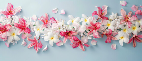 Spring floral arrangement with lilies and plumeria
