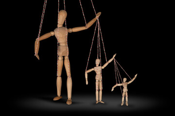 Wooden puppet doll, dancing marionette. Concept of emotional manipulation, world conspiracy theories