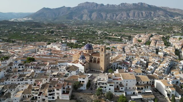 Aerial view from a drone of Altea&rsquo;s old town and iconic blue-domed church with mountains in the background. Picturesque coastal village on Spain&rsquo;s Costa Blanca.