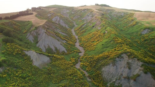 Aerial drone flight through balze cliffs canyon in Tuscany