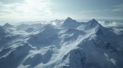 Obraz premium Aerial view of snow covered mountain range under a bright sky. The rugged peaks and valleys are blanketed in snow, creating a serene and majestic winter landscape.