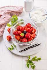 Preparing homemade strawberry jogurt with fresh fruits