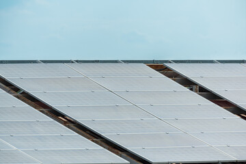 Solar panels and blue sky background.Solar cells farm on the roof and sunset.Photovoltaic modules...