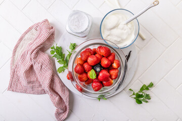Preparing homemade strawberry jogurt with fresh fruits