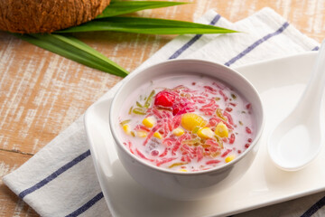 Thai iced dessert (Ruam Mit),Popular Thai Fruit Dessert in Coconut Milk in white bowl.
