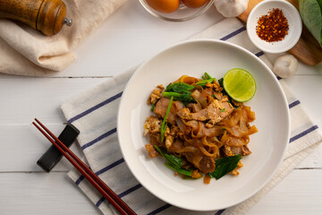 stir fry konjac flat noodles with garlic sliced pork meat kale and chicken egg with dark sauce (Pad See Ew).healthy low calorie meals.Diet food.ketogenic diet.