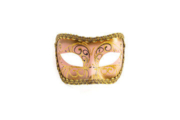 Pink colored carnival mask with golden glitter decorations, close up isolated on white