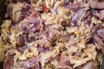 Chicken liver preparation with onion garlic and celery in a boiling pot, pate recipe process