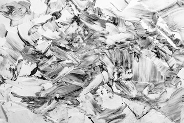 Putty paste mixed with black ink, abstract close up detail of spatula strokes on stucco renovation, empty backdrop