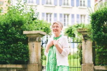 Outdoor portrait of beautiful maure 55 - 60 year old woman