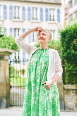 Outdoor portrait of beautiful maure 55 - 60 year old woman