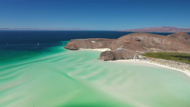 Aerial view of turquoise water and white sand beach at Balandra beach in La Paz, Baja California Sur, Mexico