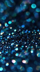 Macro texture of dark sparkling nail polish with shimmering blue and multicolor glitter under soft bokeh lighting