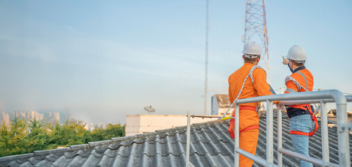 Telecommunication Engineers Working on 5G Tower,Technicians Climbing High Telecom Poles,Ensuring Network Maintenance with Safety Equipment