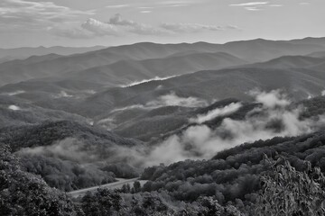 Obraz premium Monochrome mountains embrace ethereal fog layers