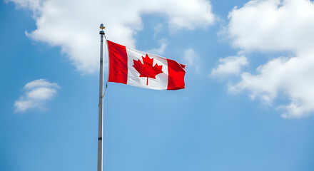 Canadian flag waving in the wind against a blue sky with white clouds national symbol of canada
