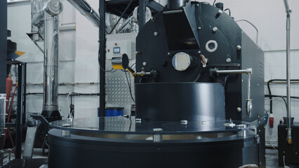 Coffee roasting machine in operation at a modern