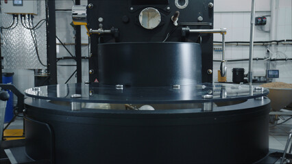 Modern coffee roasting machine operating in