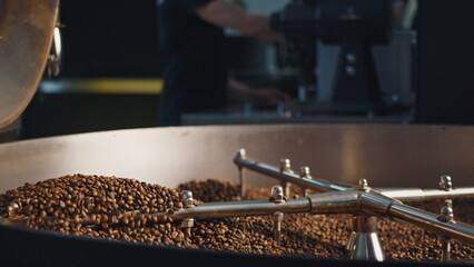 Coffee beans roasting in a large industrial coffee