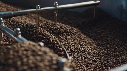 Coffee beans roasting in a large industrial