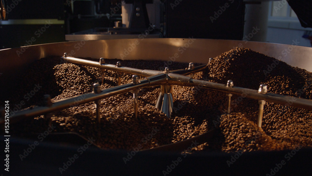 Poster coffee beans rotating in roasting machine during