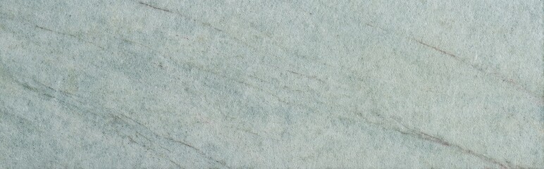 Fototapeta premium Honed soapstone texture with light green and gray veining pattern