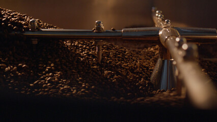 Coffee beans roasting in a large industrial coffee