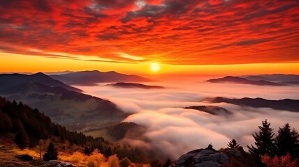 Obraz premium A breathtaking sunrise with intense orange and red clouds stretching across the sky, the Carpathian peaks in silhouette, mist clinging to the valleys, the sun just emerging over the horizon.
