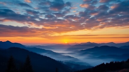 Fototapeta premium A bright golden sunrise breaking over the Carpathian range, vivid orange and yellow clouds glowing against a fading deep blue sky, mountains in dark silhouette, soft mist on the horizon.