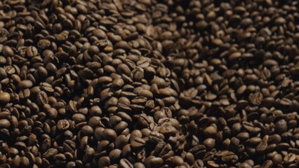 Roasted coffee beans forming textured background