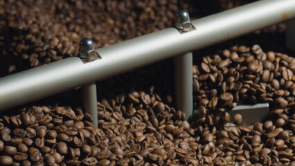 Coffee beans mixing in roasting machine during