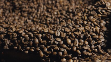 Roasted coffee beans forming a small mountain of