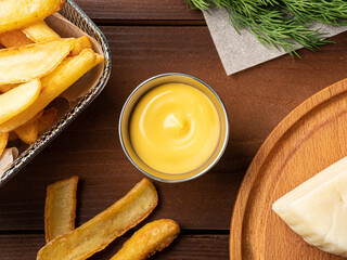 cheese sauce in a metal sauce pan, photo for restaurant menu