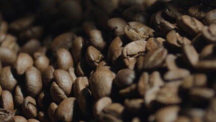 Roasted coffee beans piled high, filling the frame