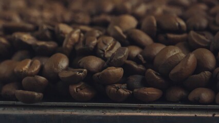 Roasted coffee beans piled up and cooling down on