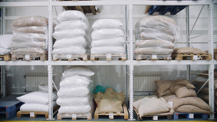 Sacks of coffee beans resting on pallets in