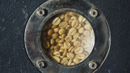 Roasting coffee beans, observing raw coffee
