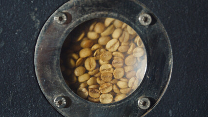 Coffee beans roasting in a professional roasting
