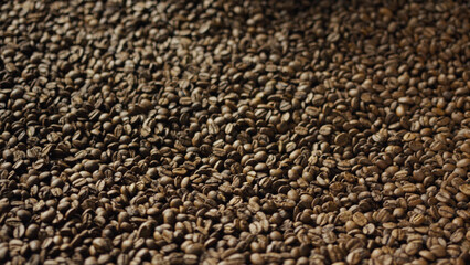 Roasted coffee beans forming a textured brown