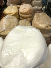 Collection of various grains and rice bags in storage