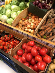 Fresh vegetables displayed at a market during the daytime