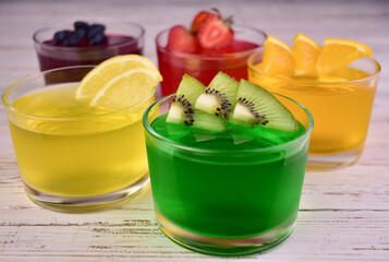 Various jellies in glasses. Assorted cool jelly desserts.
