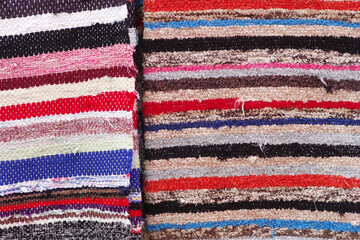 multicolored textile carpet in exposition on market