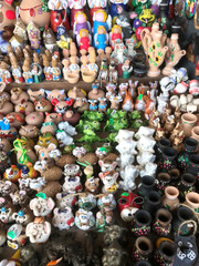 Colorful handmade ceramics displayed in a vibrant market