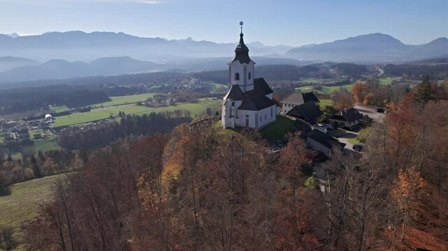 Aerial of Church of Sternberg (Pfarrkirche Sternberg St. Georg) at autumn in Carinthia, Austria.