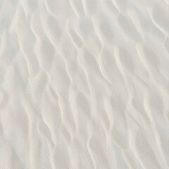 Aerial View of Textured White Sand Dunes A Serene Desert Landscape