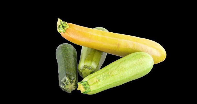 Zucchinis and courgettes. Rotation animation, seamlessly loopable. 3D rendering isolated on transparent background