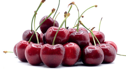 close up of beautiful red cherries on white background