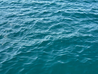 Blue ocean waves rippled water background.