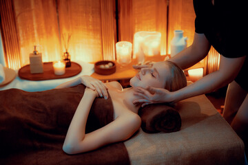 Caucasian woman enjoying relaxing anti-stress head massage and pampering facial beauty skin...